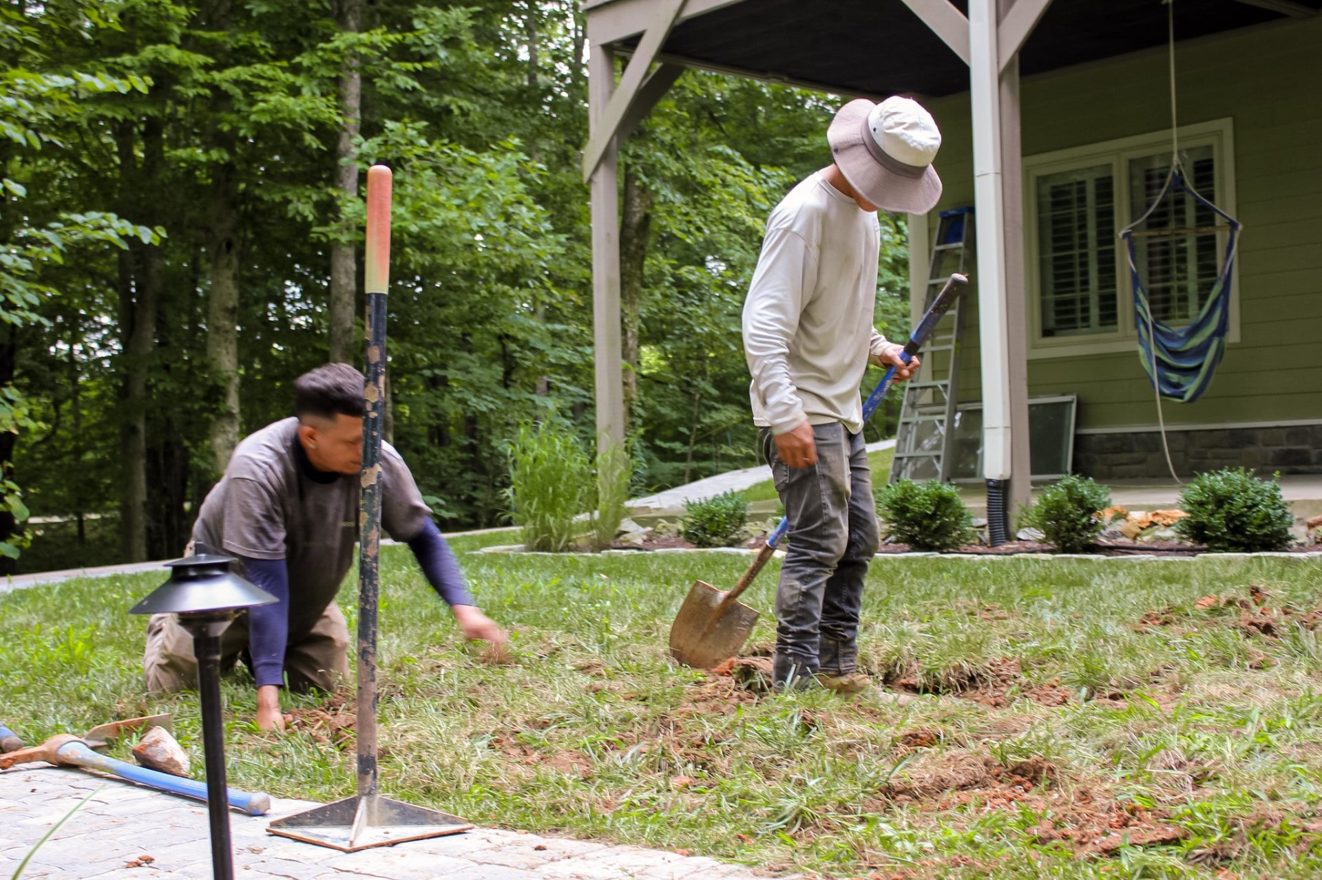 Prestige Landscape crew installing outdoor landscape lighting and path lights at Tennessee estate property
