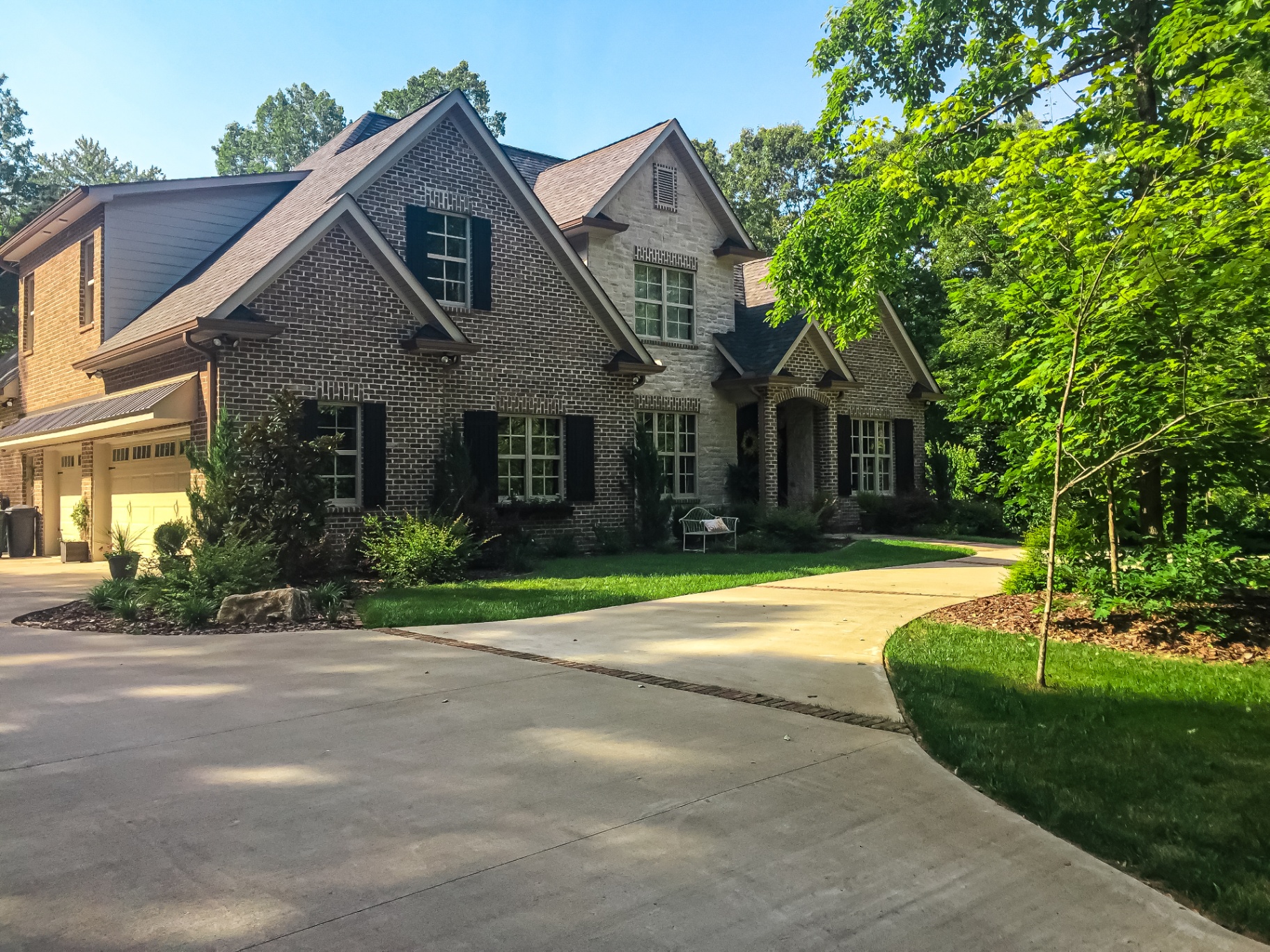 Front yard landscaping transformation with new plantings and mulch to boost Tennessee home curb appeal