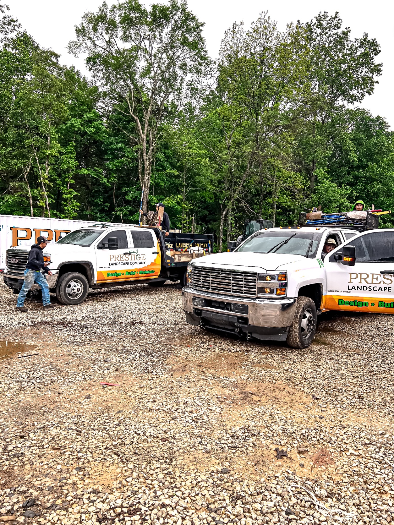 Prestige Landscape Company fleet of work trucks and crew ready for landscaping projects in Tennessee